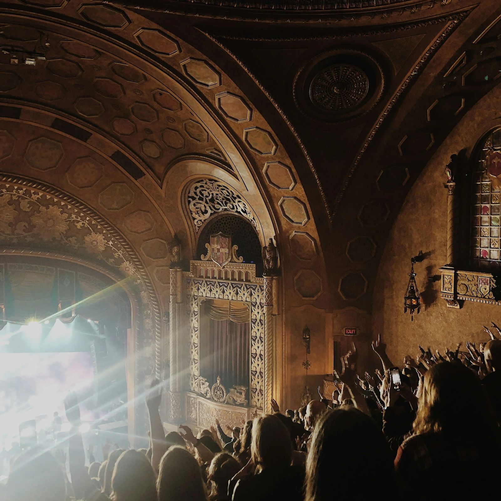 Audience seated in a historic theater
